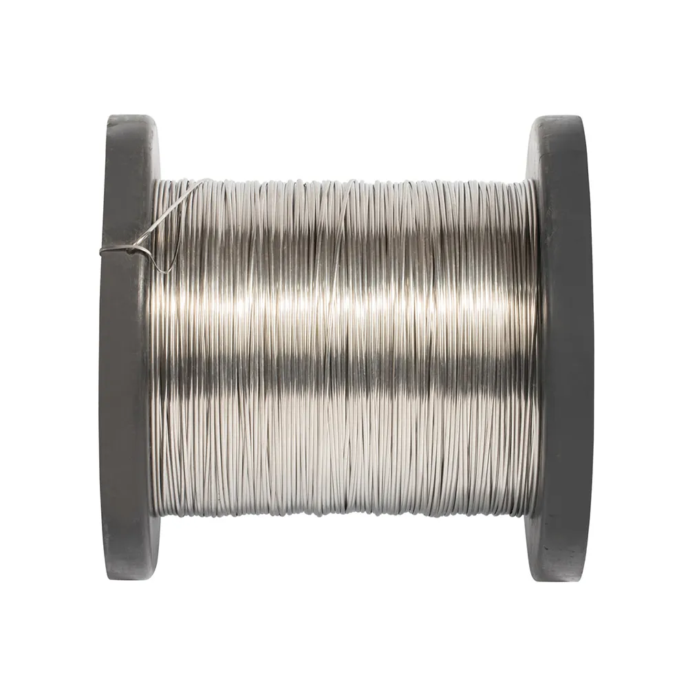 Close up of polished stainless steel round wire showing uniform shiny surface on a spool