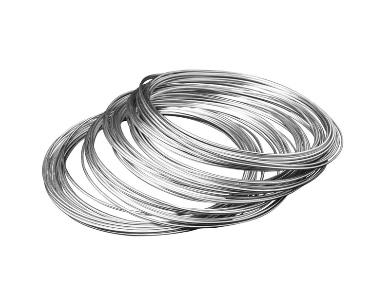 inconel profile wire, shiny inconel shaped wire coils on white background